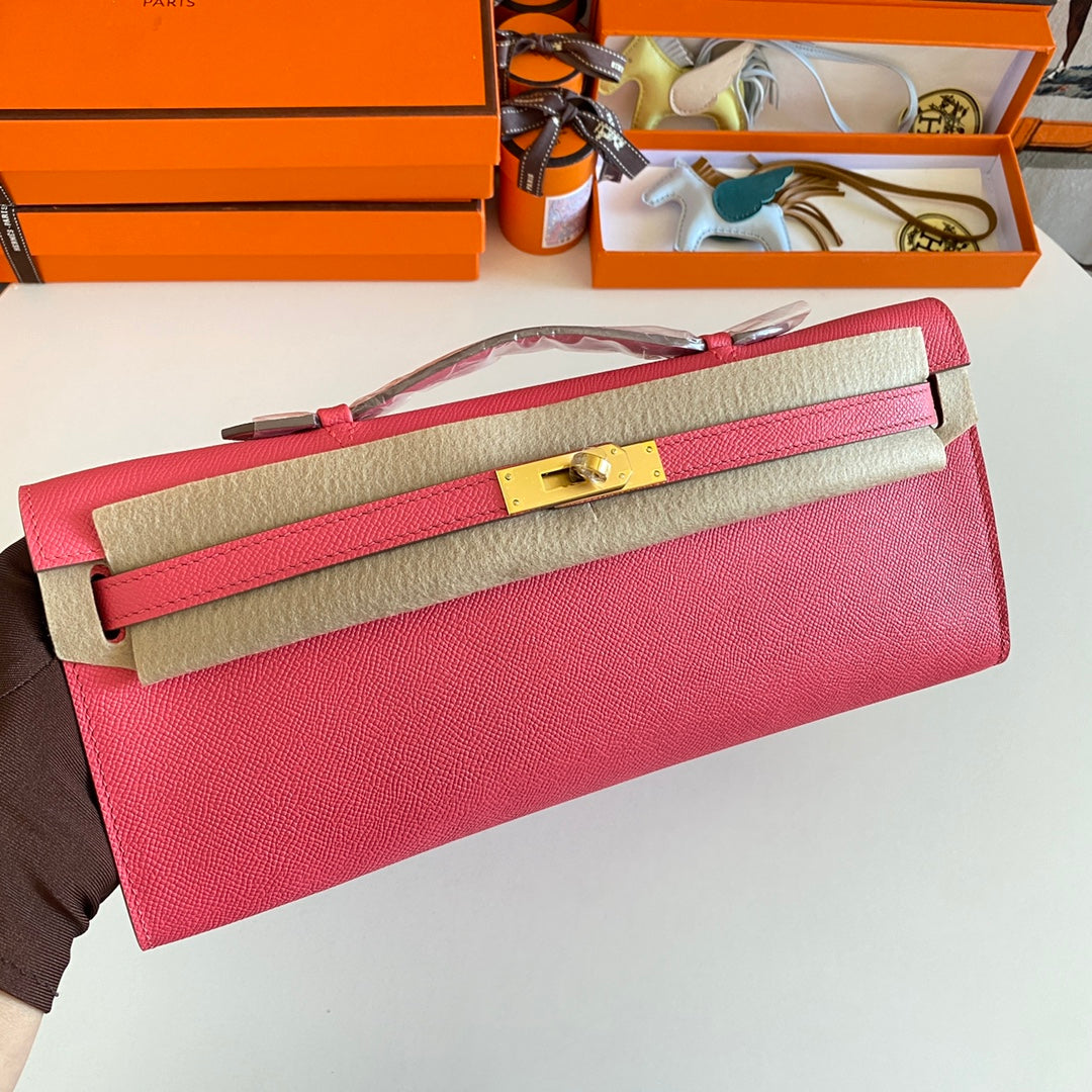 HERMES KELLY CUT 31 IN WATERMELON PINK CALFSKIN WITH GOLD HARDWARE